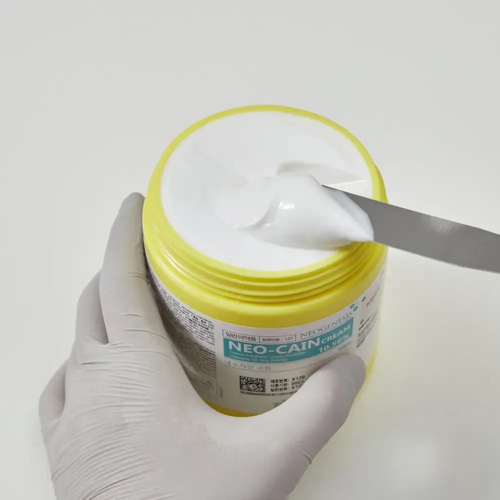 Cream tube of Derma Essence Neo-Cain Numbing Cream with 10.56% Lidocaine, 500g, made in Korea, shown in the image.